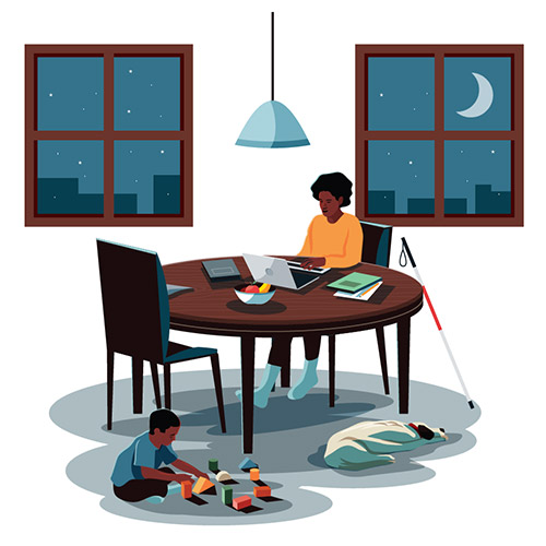 Student completing homework at night while child plays on floor.